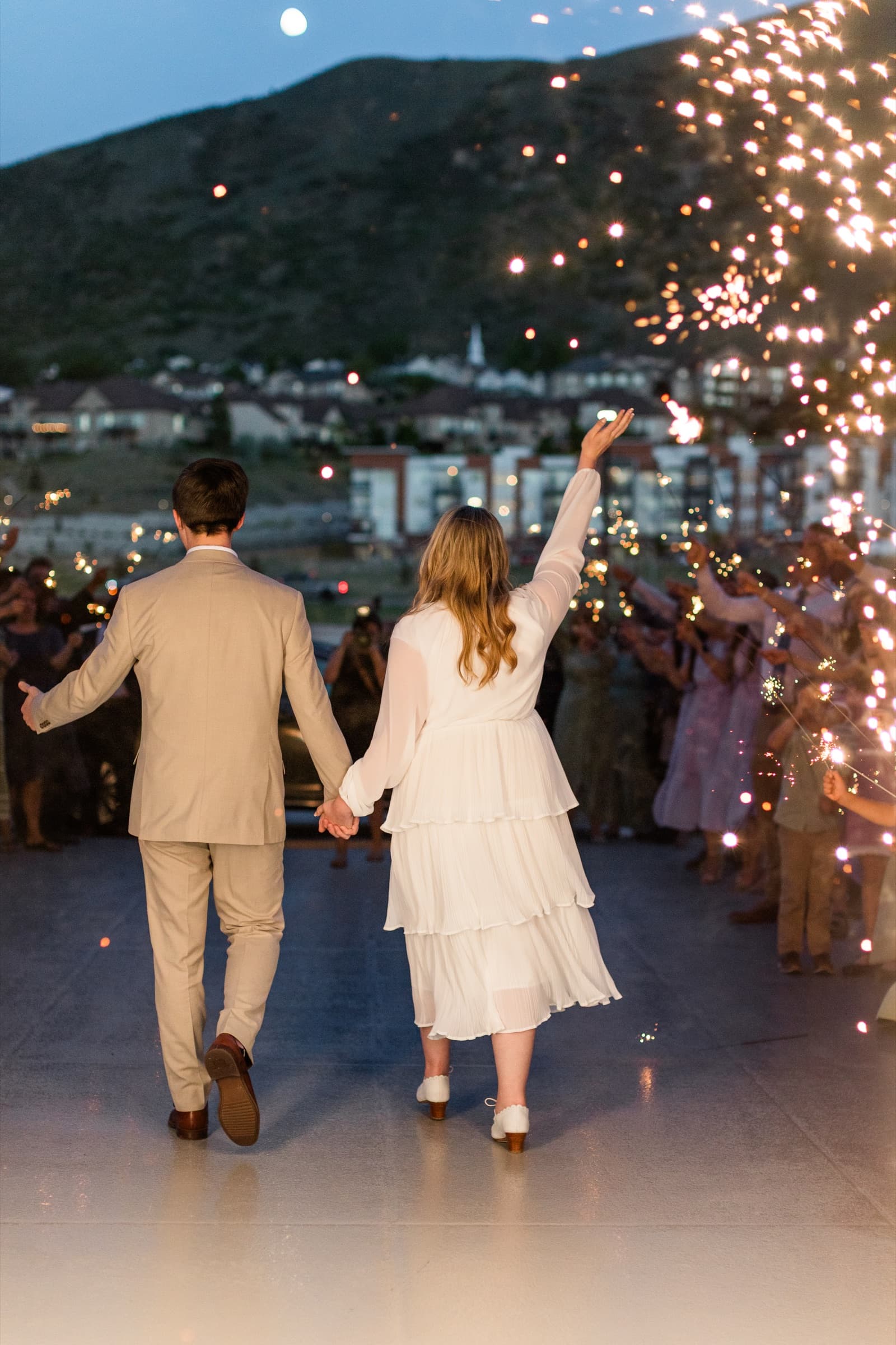 Newlyweds entering a sparkler exit at a Utah wedding